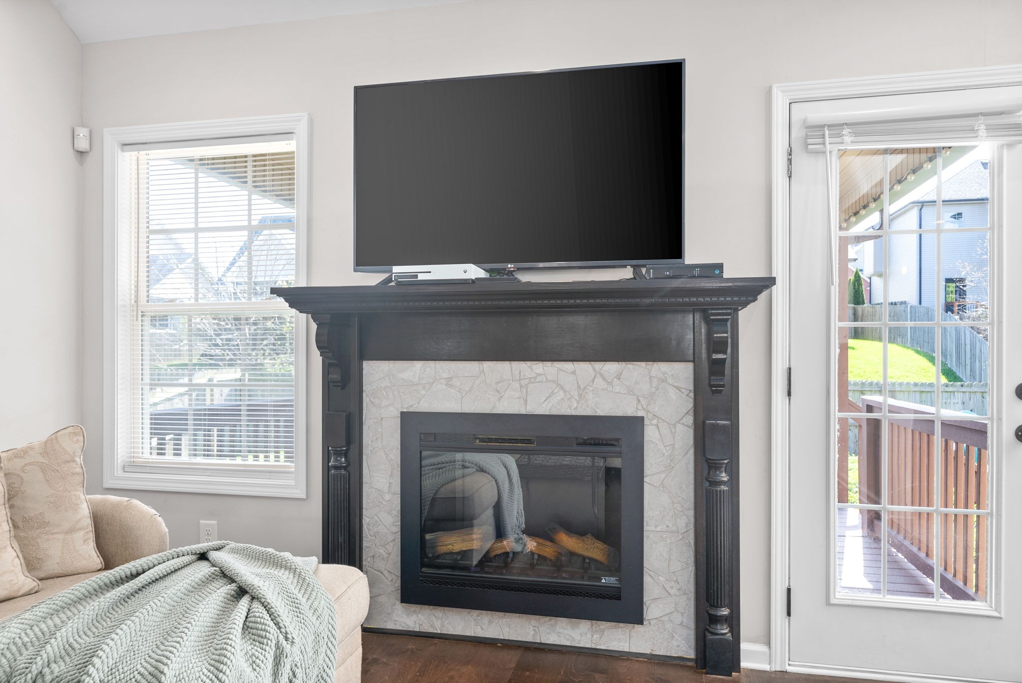 1478 Raven Road Clarksville, TN 37042 - Photo 7 of 42 a living room with a fireplace and a flat screen tv