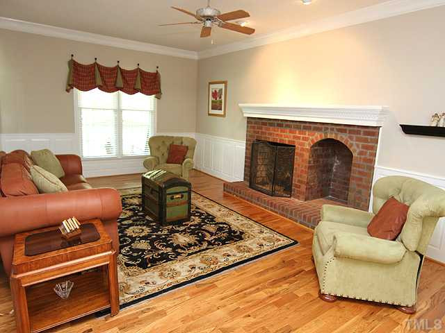 1928 Wilton Circle Raleigh, NC 27615 - Photo 8 of 17 Huge great room to set up your furniture to your lifestyle! Masonry ffreplace 9 foot ceilings, wainscoting, new interior paint. Doors opens to screened porch!