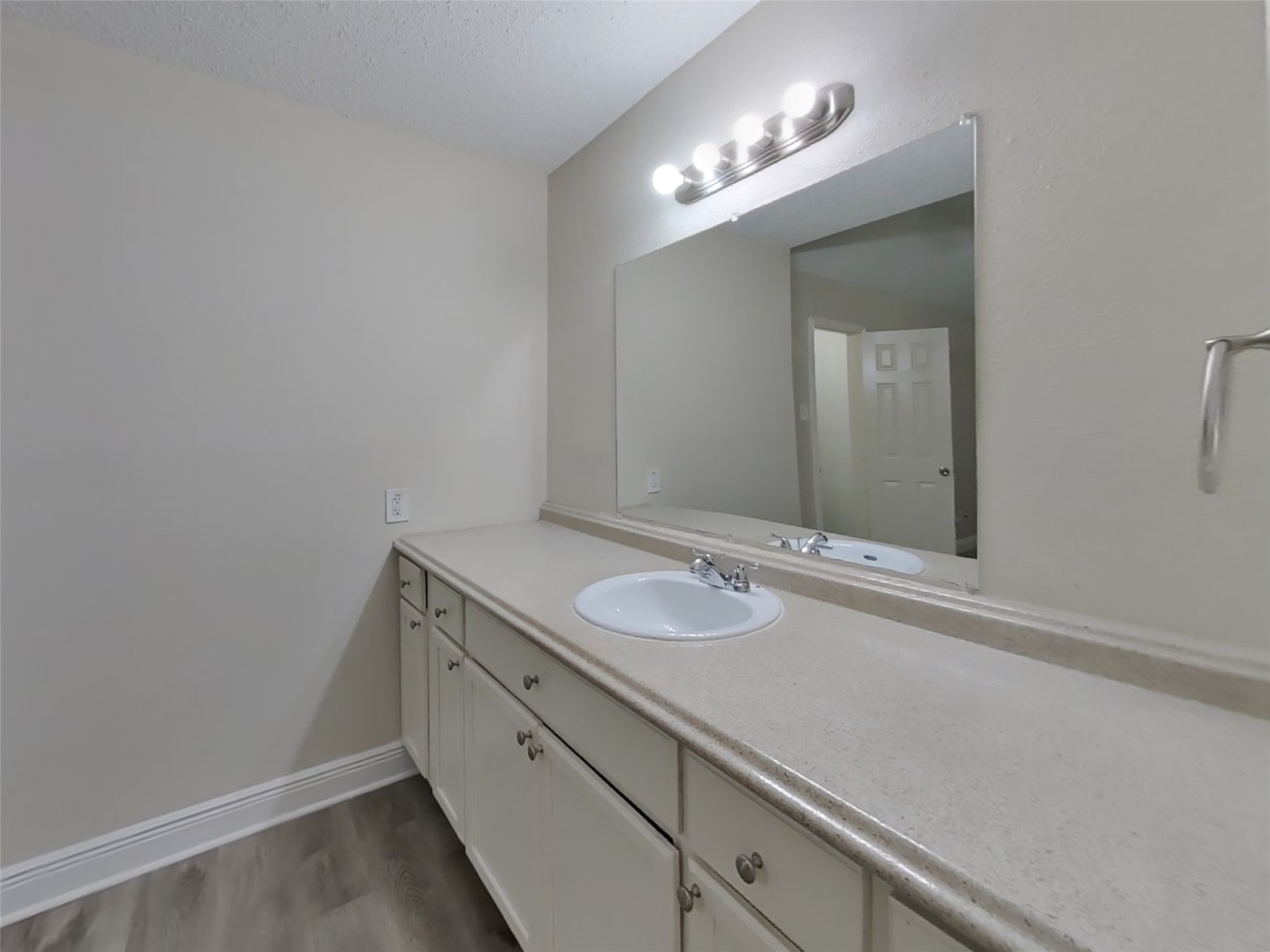 9607 Cleveland Bay Court Houston, TX 77065 - Photo 10 of 18 a bathroom with a sink and a mirror