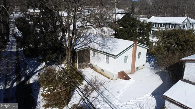a view of house with yard outdoor seating and slide