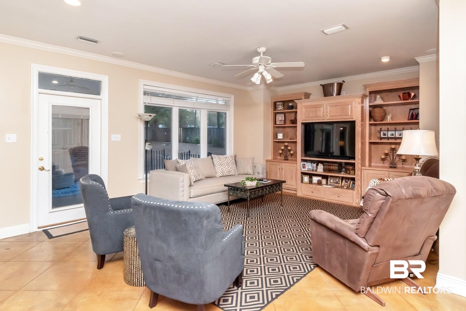 1050 Southern Way Court Mobile, AL 36609 - Photo 11 of 36 Tiled living room featuring crown molding and ceiling fan