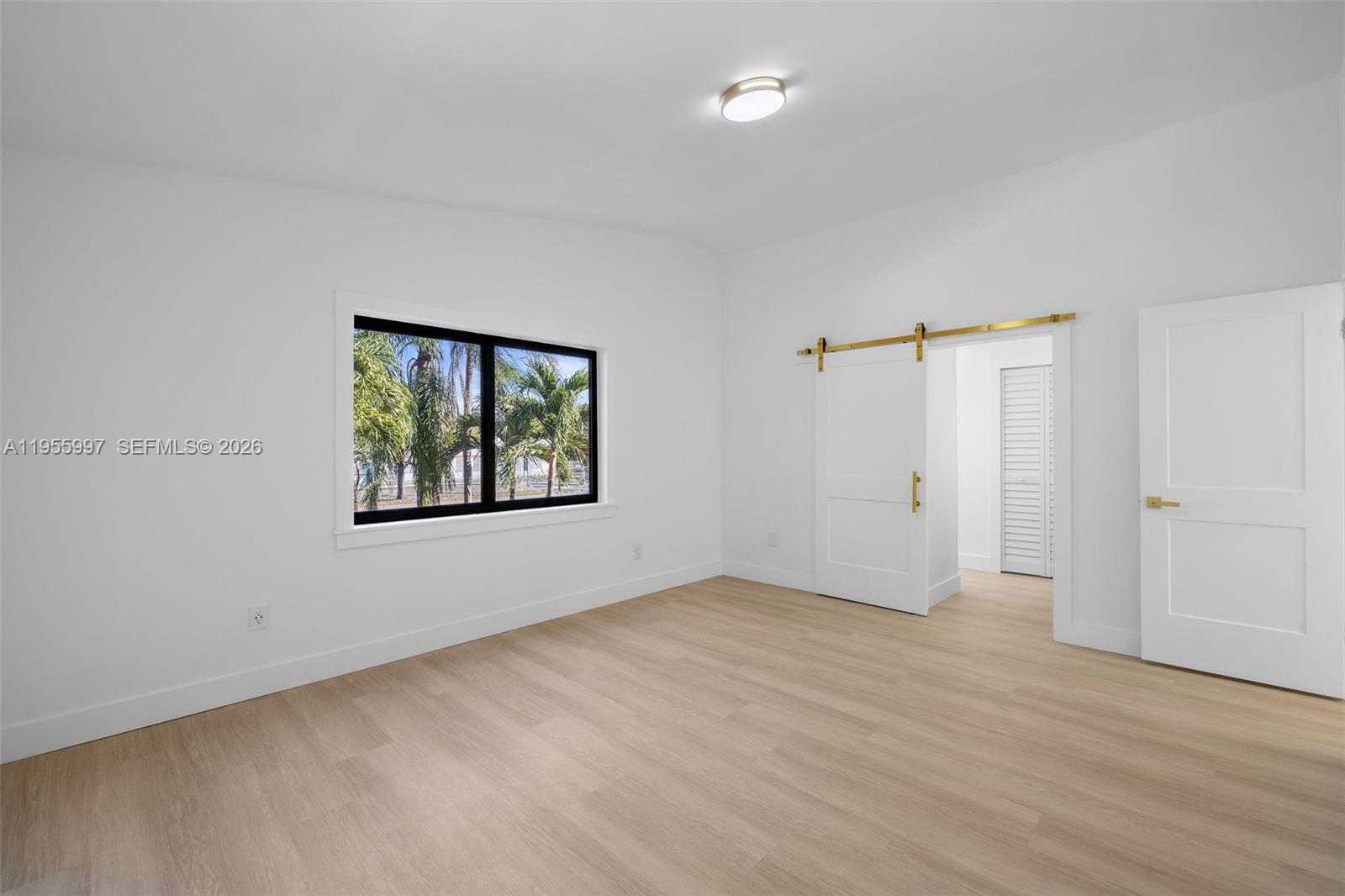 11260 Southwest 157th Court Miami, FL 33196 - Photo 15 of 29 an empty room with window