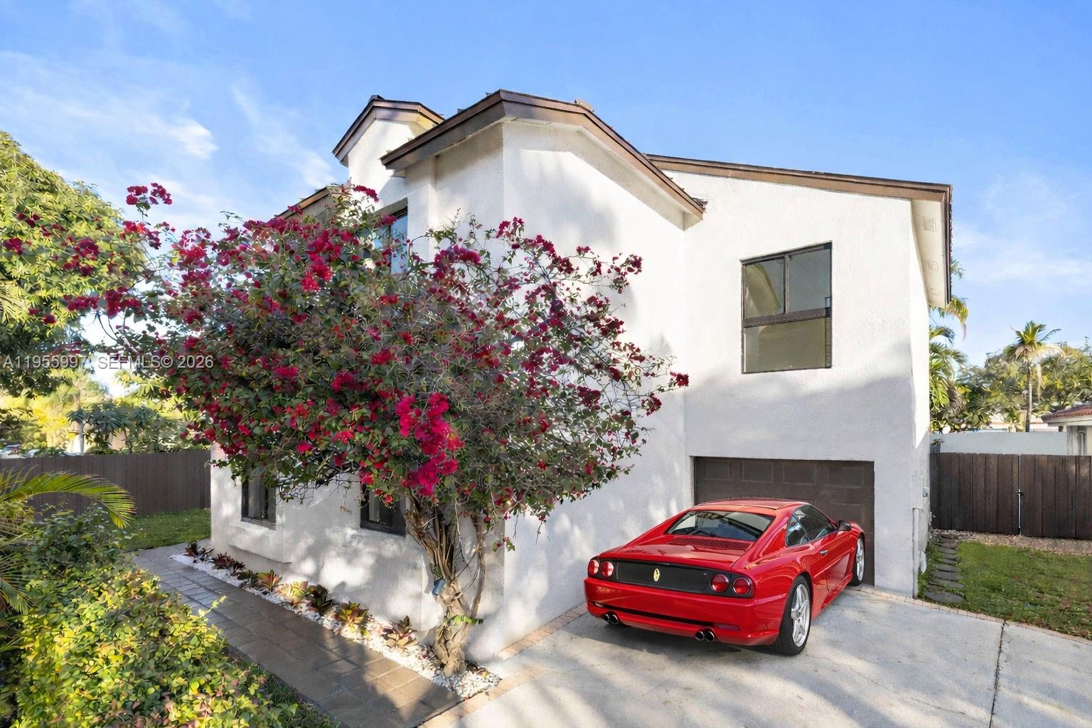 11260 Southwest 157th Court Miami, FL 33196 - Photo 2 of 29 a front view of a house with a yard