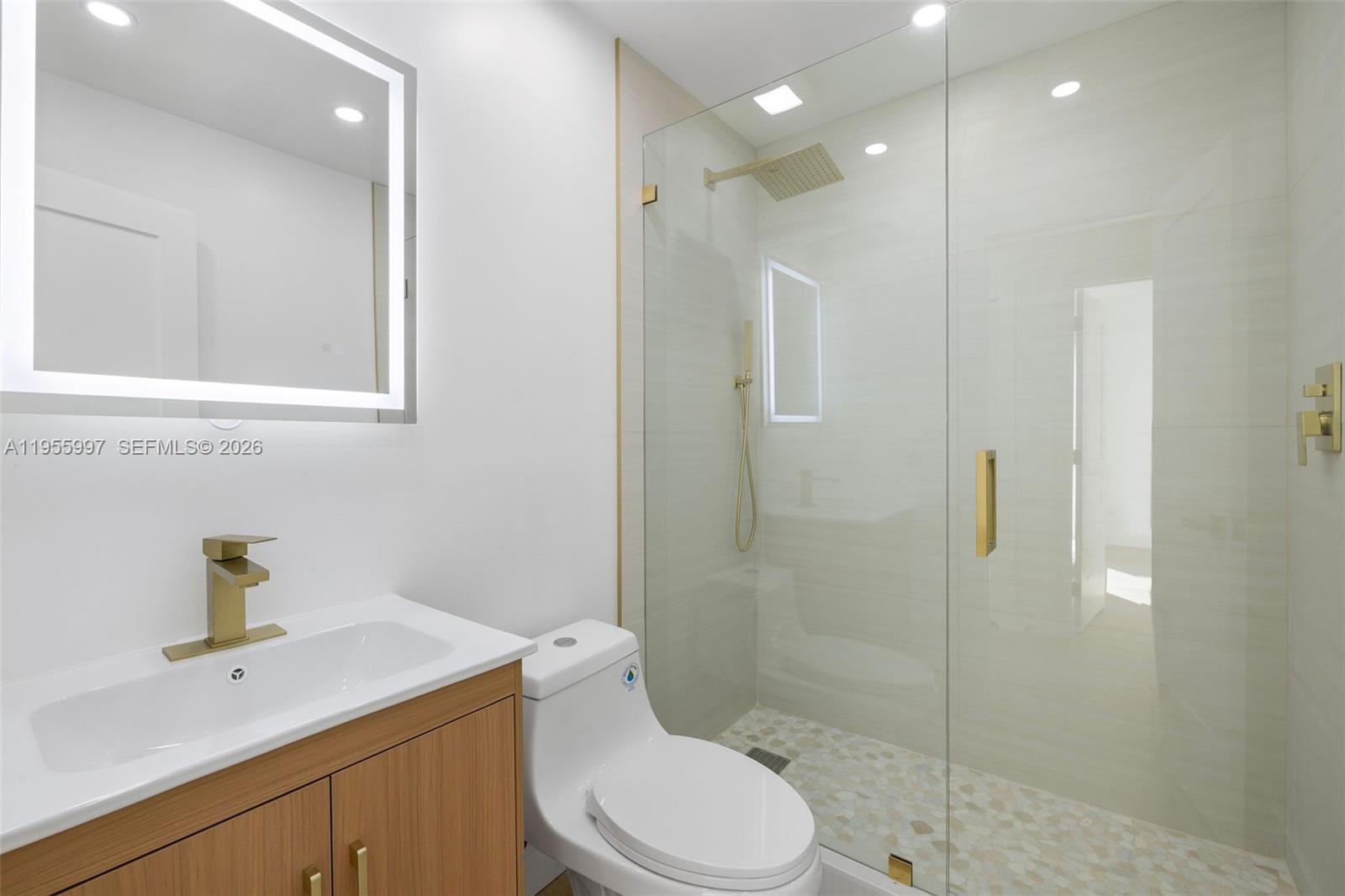 11260 Southwest 157th Court Miami, FL 33196 - Photo 21 of 29 a bathroom with a sink a toilet and shower