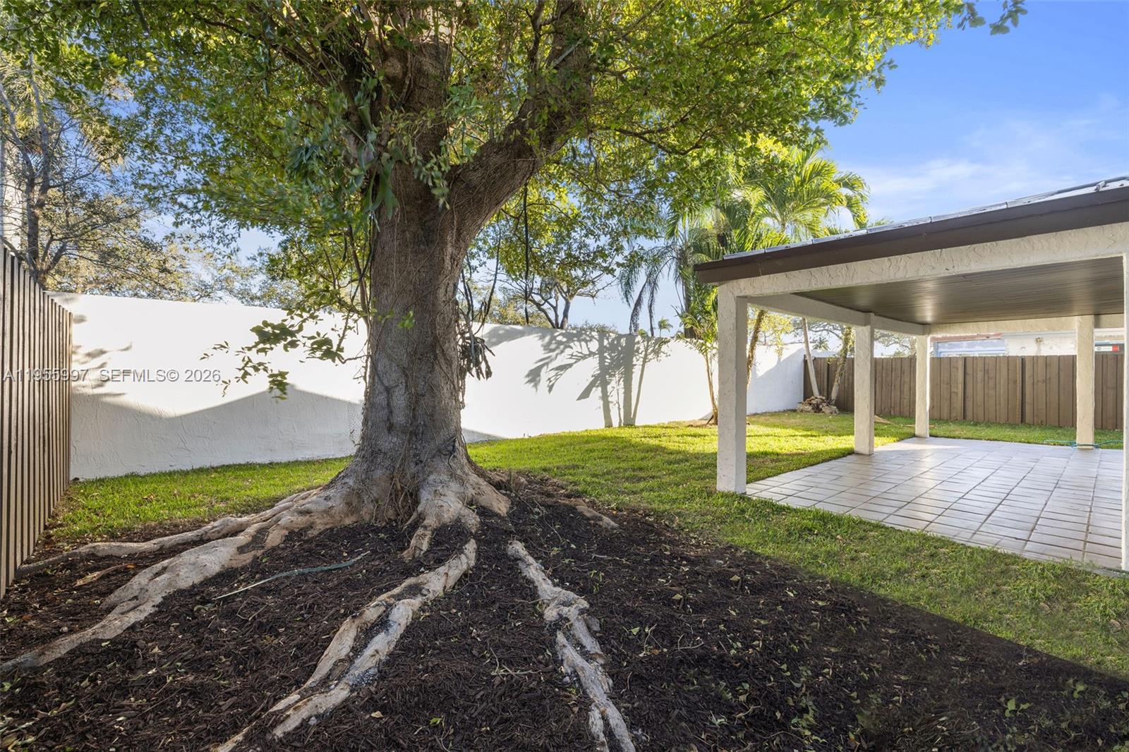 11260 Southwest 157th Court Miami, FL 33196 - Photo 24 of 29 a view of a backyard with large tree