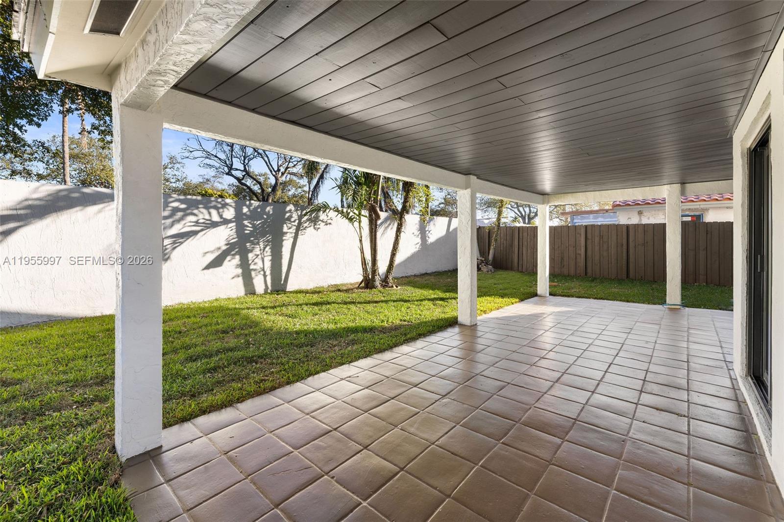 11260 Southwest 157th Court Miami, FL 33196 - Photo 26 of 29 a view of a porch with a backyard