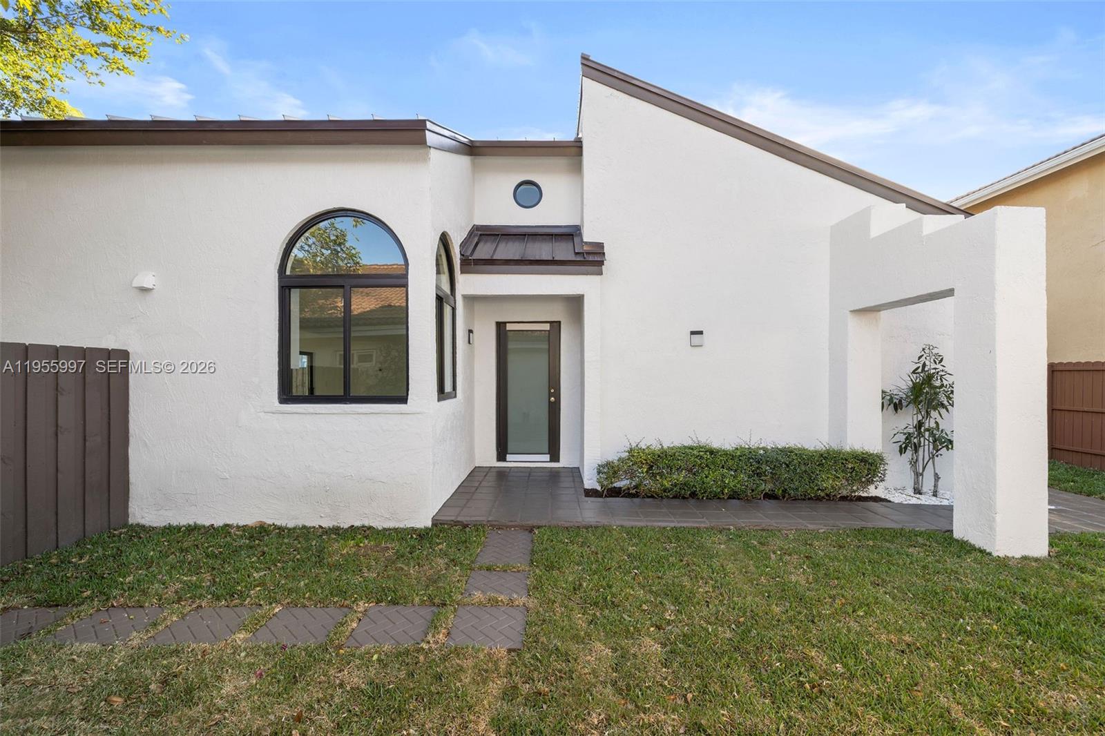 11260 Southwest 157th Court Miami, FL 33196 - Photo 5 of 29 a front view of a house with garden