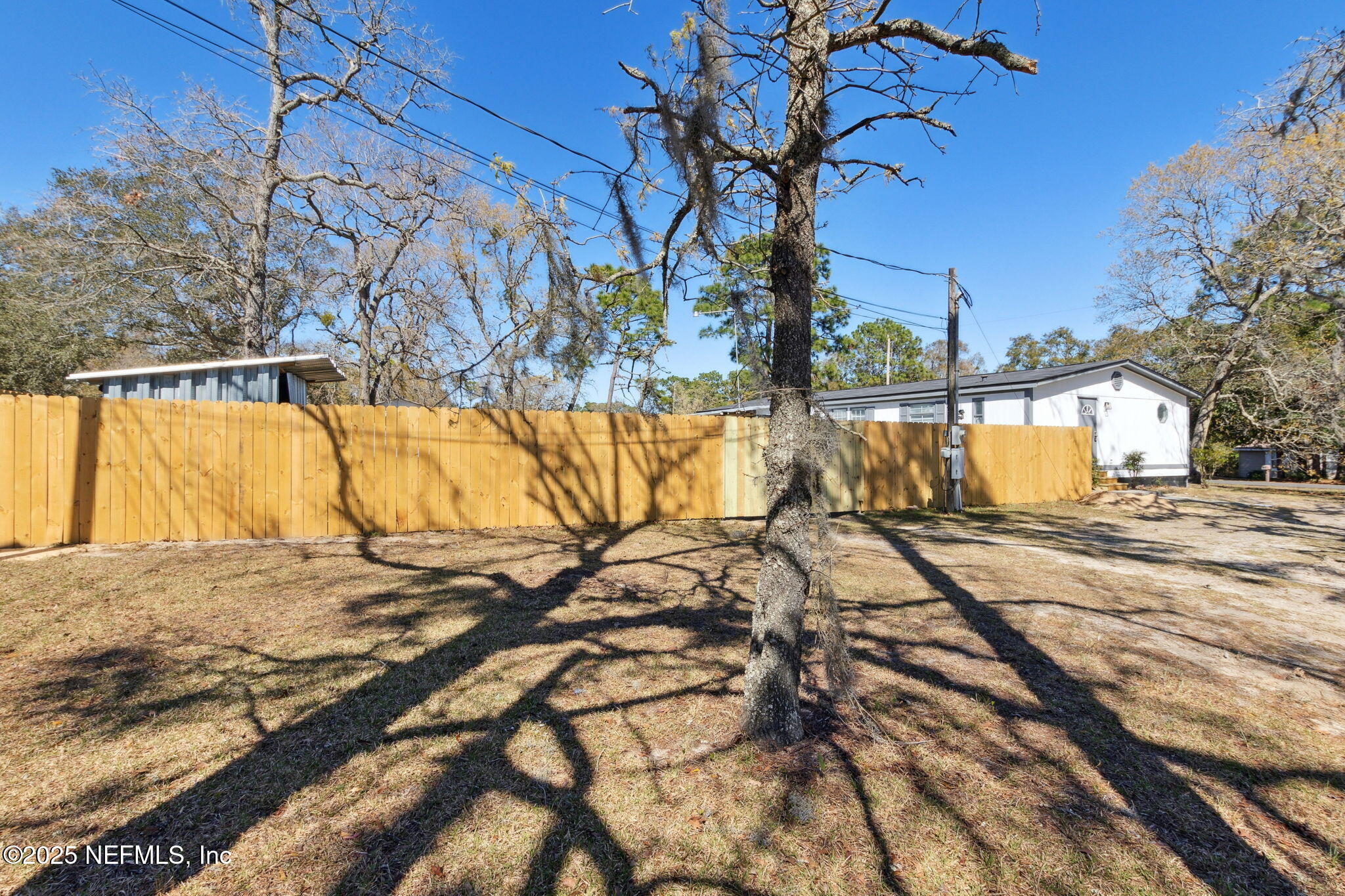 97119 Diamond Street Yulee, FL 32097 - Photo 2 of 42 a view of a swimming pool with a patio