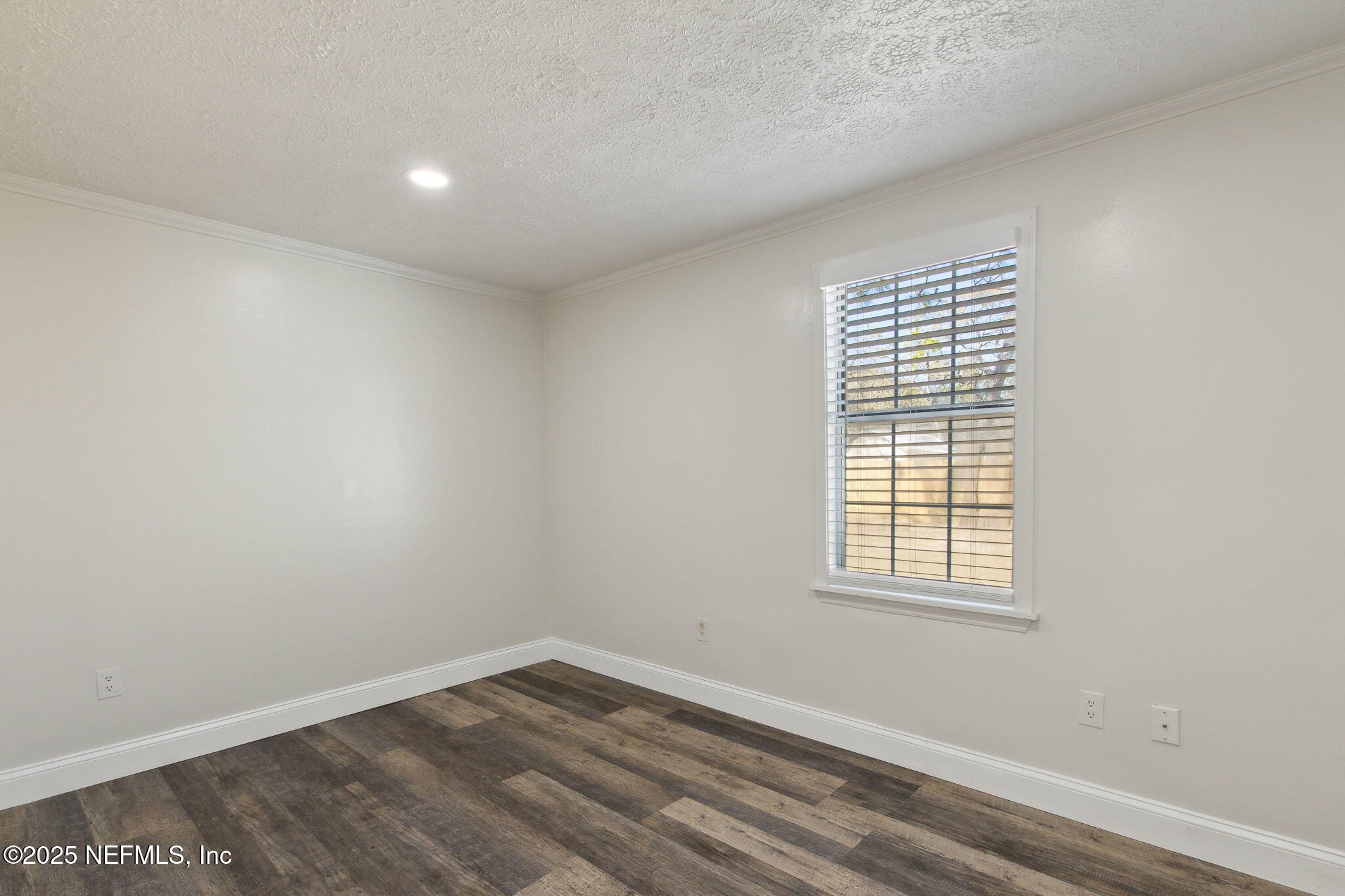 97119 Diamond Street Yulee, FL 32097 - Photo 29 of 42 an empty room with wooden floor and windows