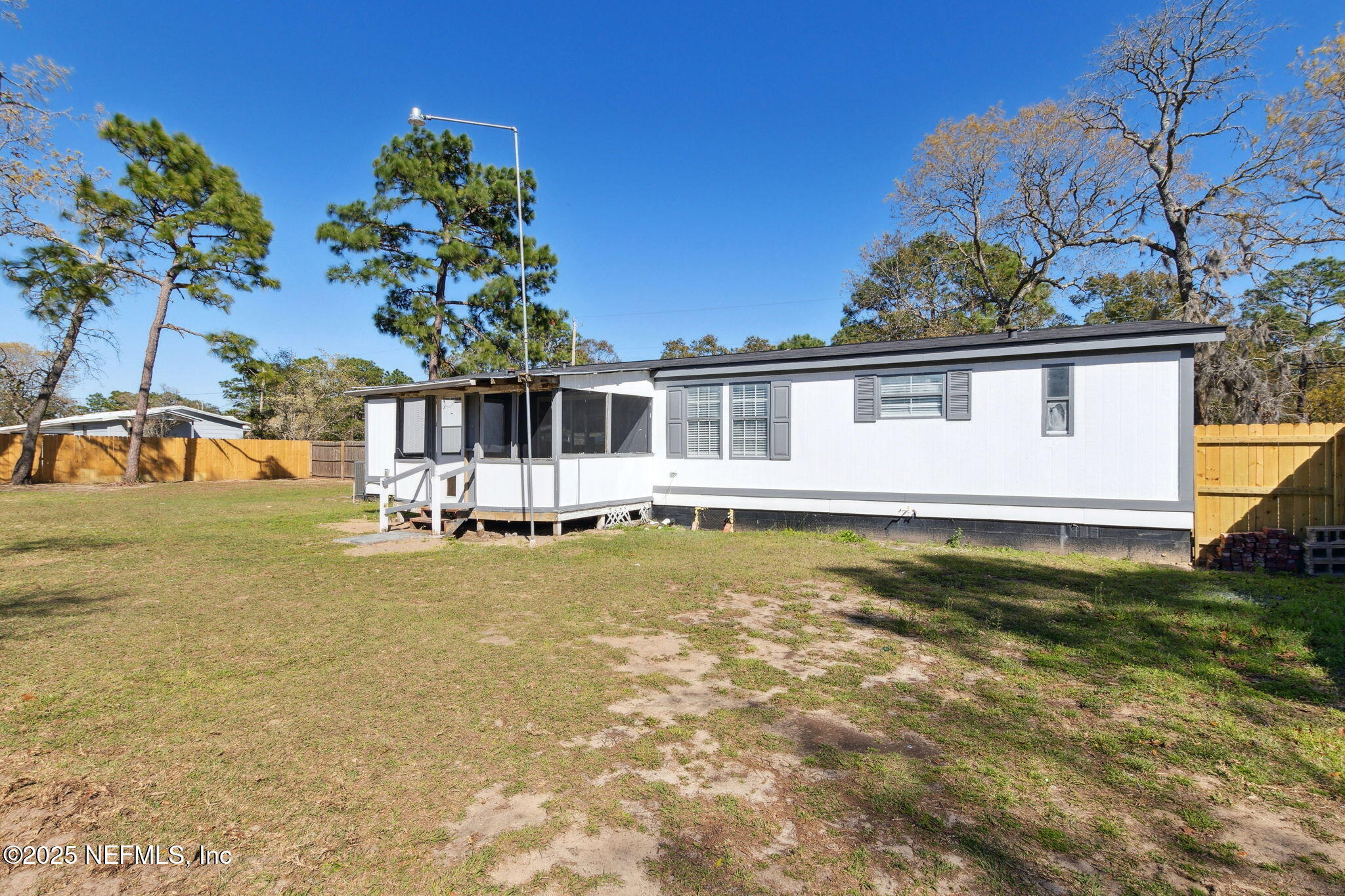 97119 Diamond Street Yulee, FL 32097 - Photo 38 of 42 a view of a house with pool and sitting area