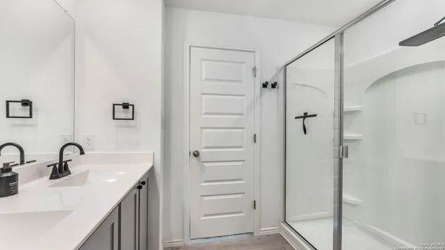 a bathroom with a sink and mirror
