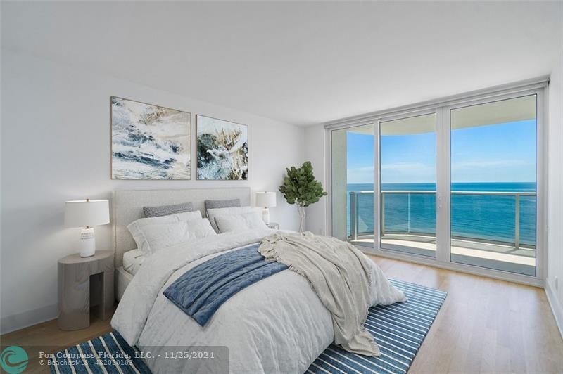 350 South Ocean Boulevard, Unit 5D Boca Raton, FL 33432 - Photo 18 of 35 a bedroom with a large bed and a large window