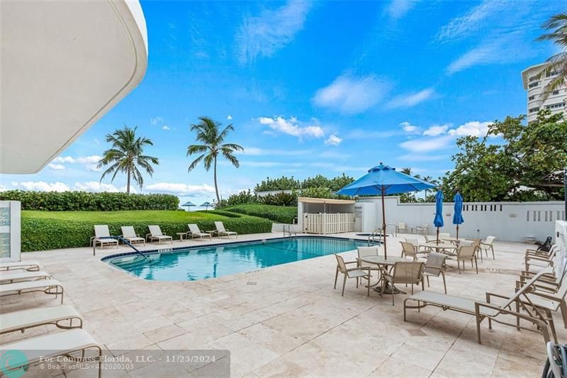 350 South Ocean Boulevard, Unit 5D Boca Raton, FL 33432 - Photo 27 of 35 a view of a patio with a table and chairs