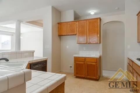 Undisclosed Address Bakersfield, CA 93311 - Photo 12 of 23 a kitchen with stainless steel appliances granite countertop a sink and a refrigerator