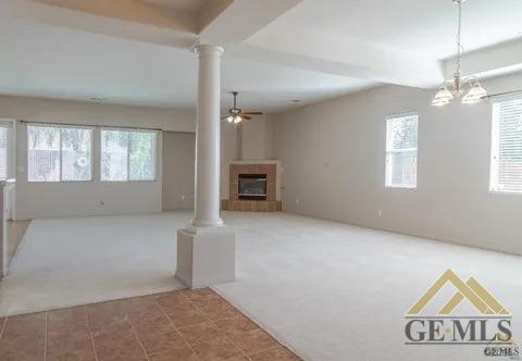 Undisclosed Address Bakersfield, CA 93311 - Photo 7 of 23 an empty room with windows and cabinet