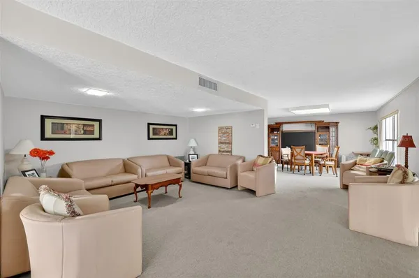 a living room with furniture and white walls