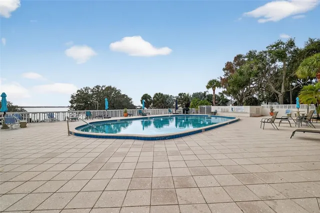 a view of a swimming pool with a patio