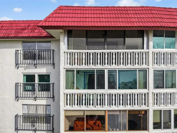 a view of a house with large windows