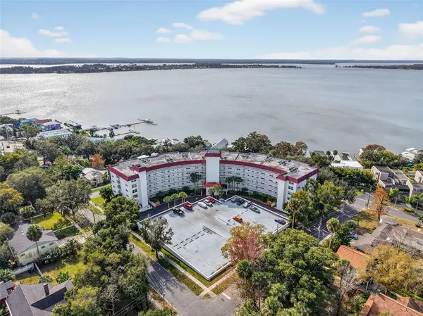 a picture of city view with lake view and boat in the back