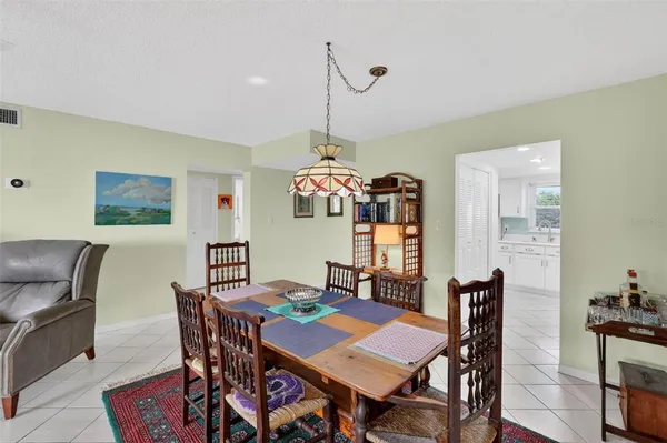 a dining room with furniture and window