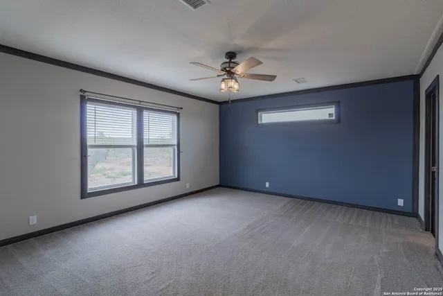 a spacious bathroom with a double vanity sink and a mirror