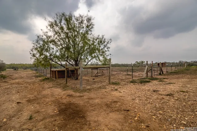 a kitchen with refrigerator and windows