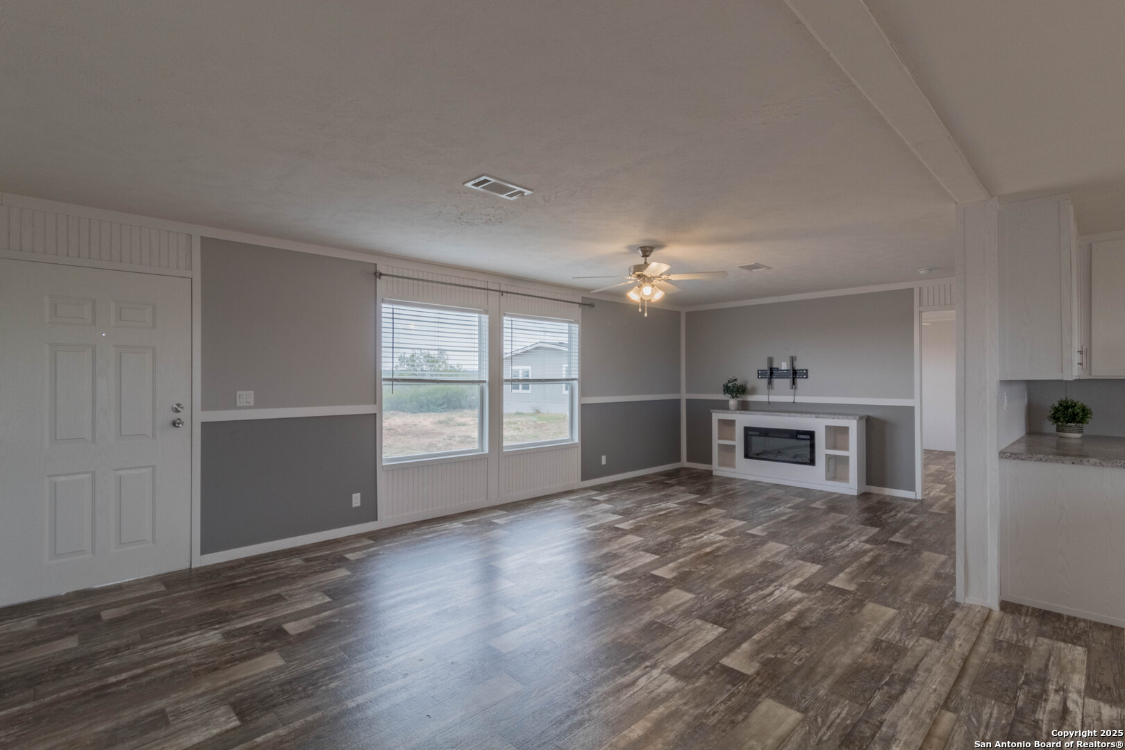 290 Lilly Bear Lane Moore, TX 78057 - Photo 42 of 62 a view of a room with wooden floor and kitchen