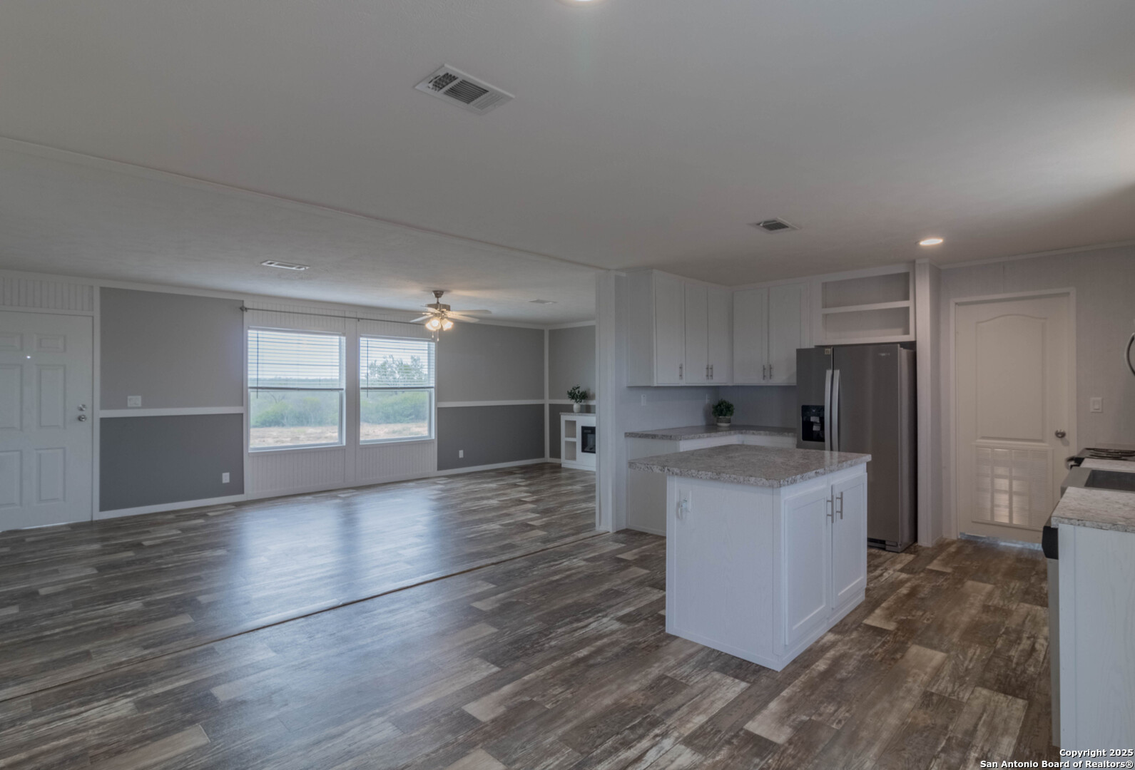 290 Lilly Bear Lane Moore, TX 78057 - Photo 46 of 62 a view of kitchen with sink microwave and refrigerator