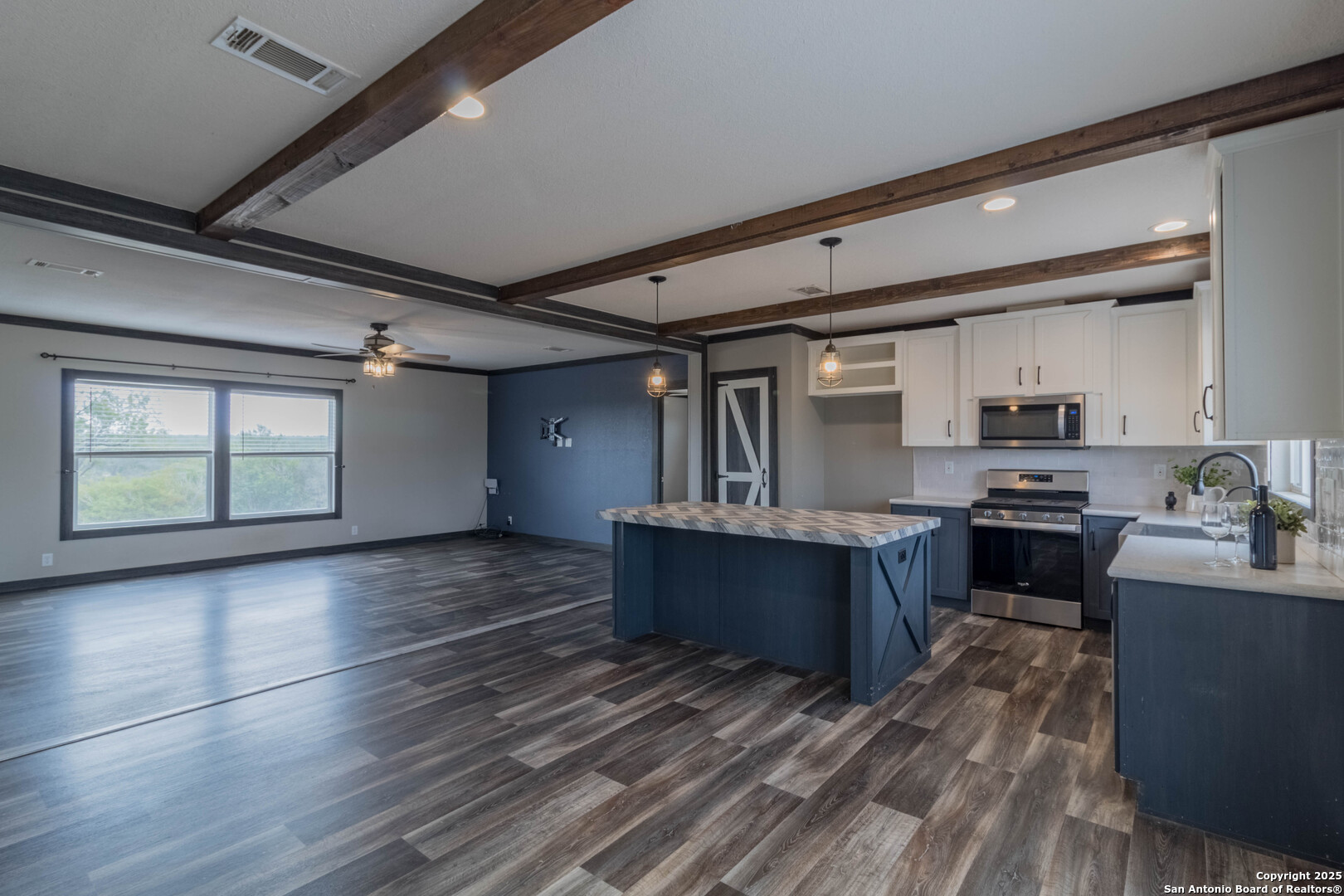 290 Lilly Bear Lane Moore, TX 78057 - Photo 7 of 62 a large kitchen with stainless steel appliances granite countertop a stove and a refrigerator