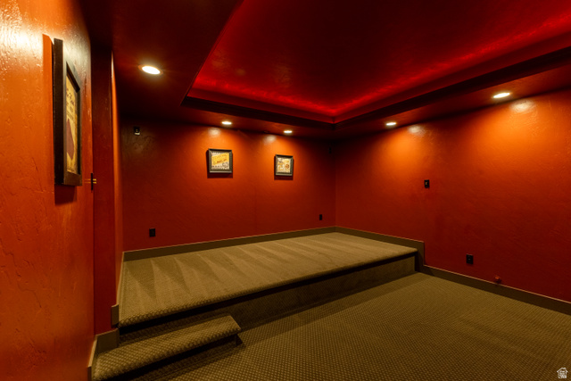 3565 West 1350th Street North Vernal, UT 84078 - Photo 37 of 54 Dedicated media room featuring a raised platform, recessed lighting, and a tray ceiling with accent lighting