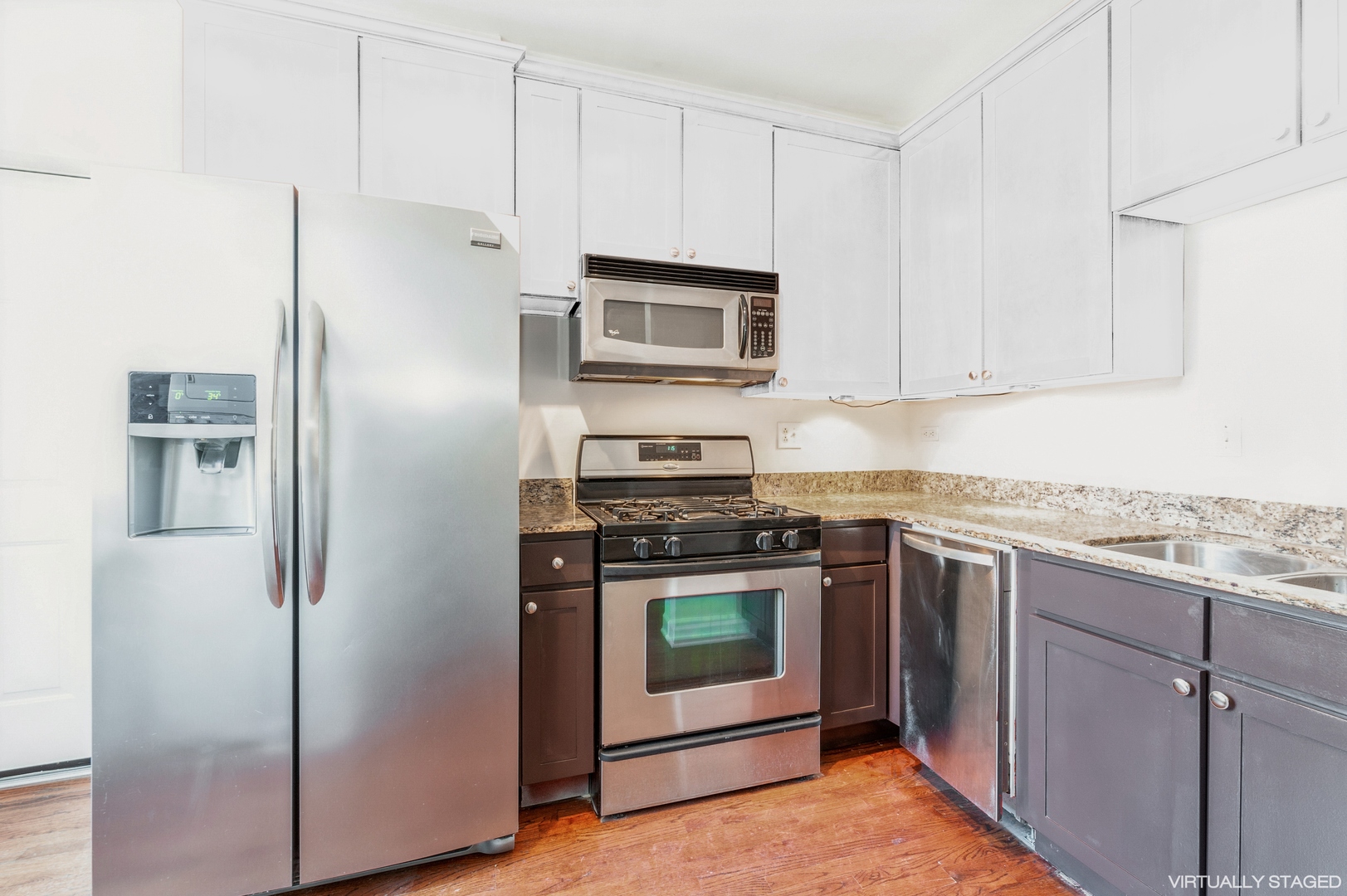5743 North Ridge Avenue, Unit 1 Chicago, IL 60660 - Photo 6 of 12 a kitchen with granite countertop cabinets stainless steel appliances and a counter space