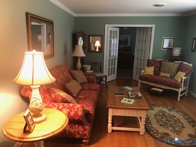 9401 Gum Fork Road Midlothian, VA 23112 - Photo 15 of 28 a living room with furniture and a lamp