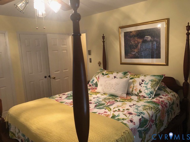 9401 Gum Fork Road Midlothian, VA 23112 - Photo 22 of 28 a bedroom with a bed and a painting on the wall