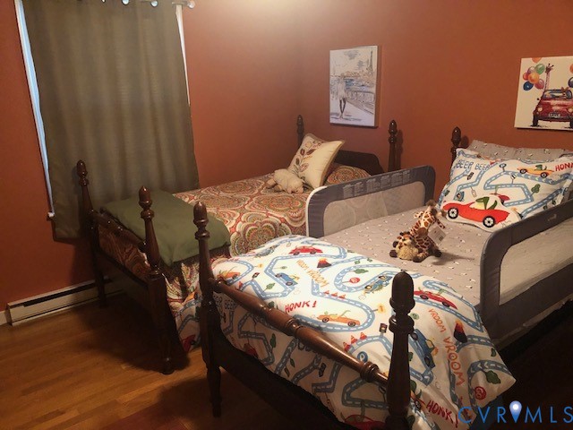 9401 Gum Fork Road Midlothian, VA 23112 - Photo 23 of 28 a bedroom with a bed and a table in it