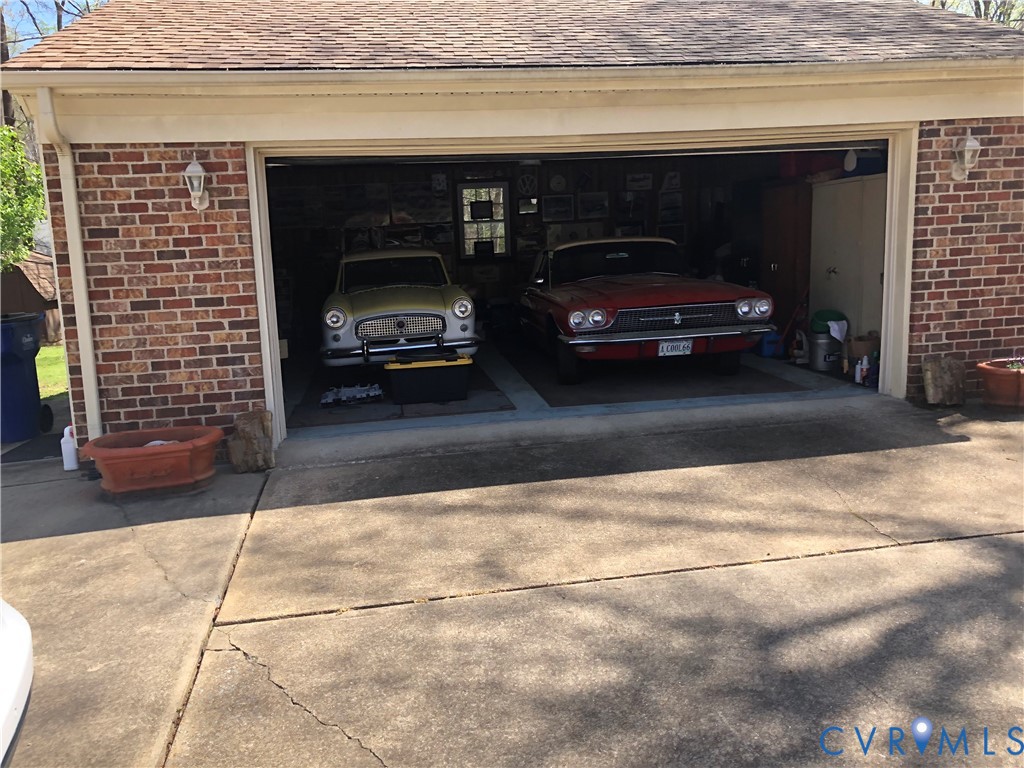9401 Gum Fork Road Midlothian, VA 23112 - Photo 27 of 28 a view of garage with a car parked in it