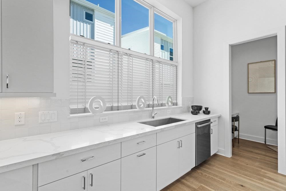2805 McCurdy Street, Unit 7 Austin, TX 78723 - Photo 12 of 40 a bathroom with double sink and a large mirror