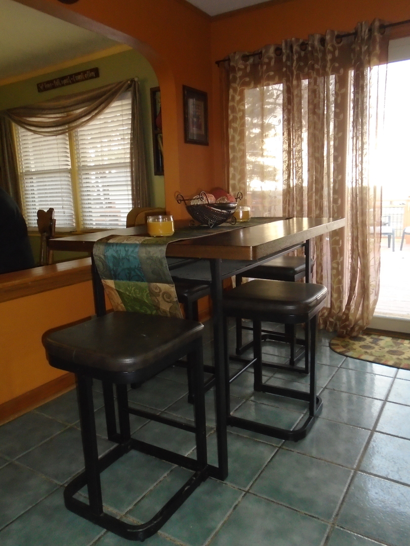 4121 East 2nd Road Mendota, IL 61342 - Photo 12 of 31 a view of a dining room with furniture window and outside view