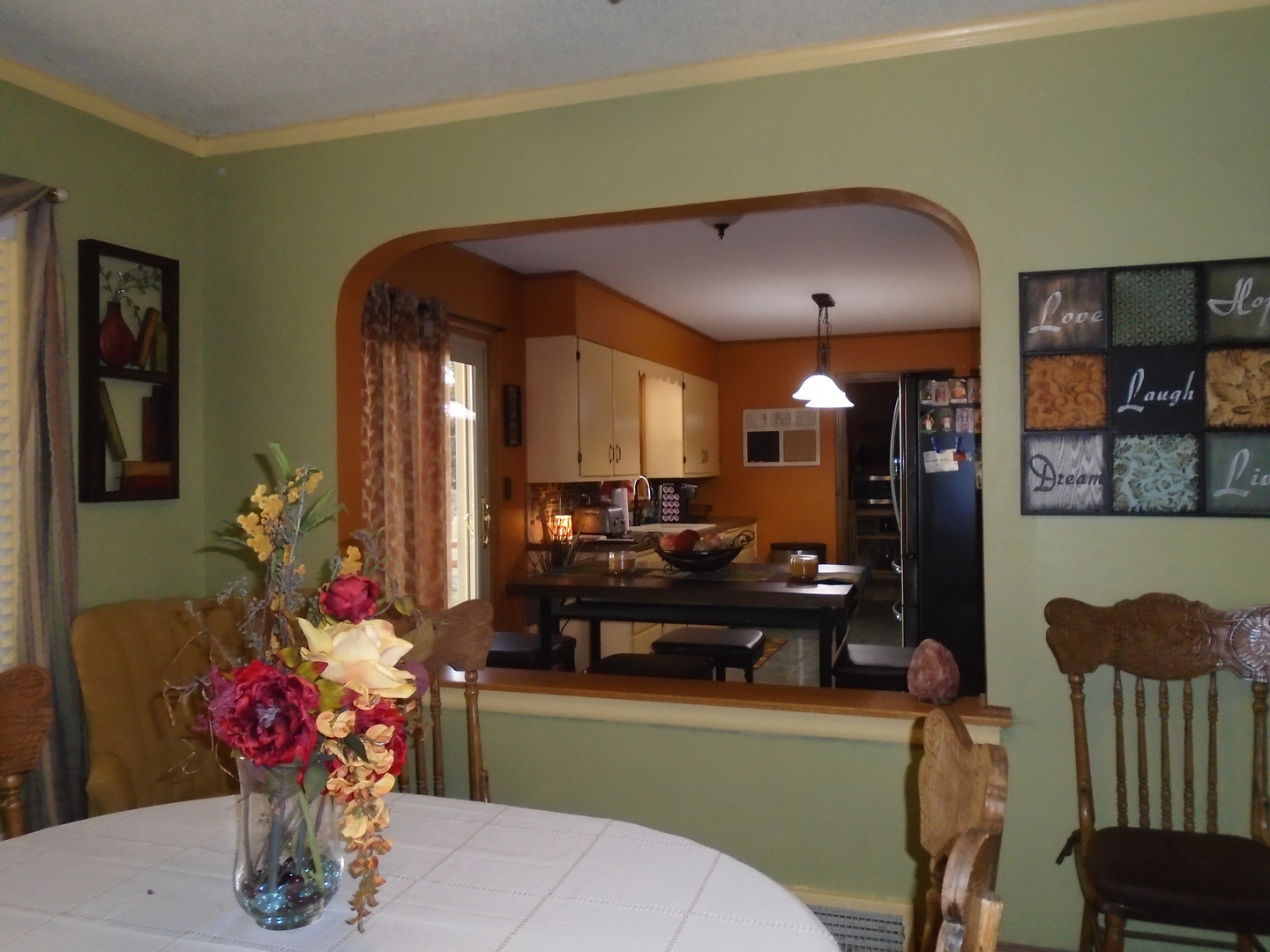 4121 East 2nd Road Mendota, IL 61342 - Photo 3 of 31 a living room with furniture and flowers