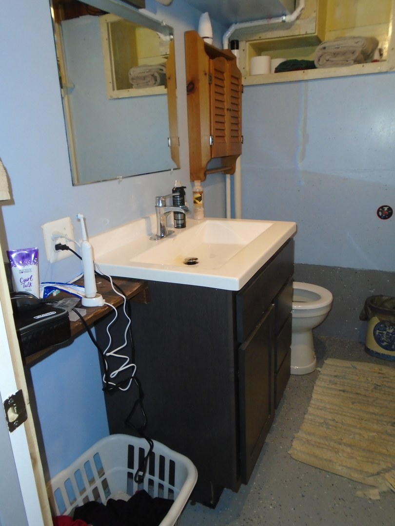4121 East 2nd Road Mendota, IL 61342 - Photo 26 of 31 a bathroom with a sink and a toilet