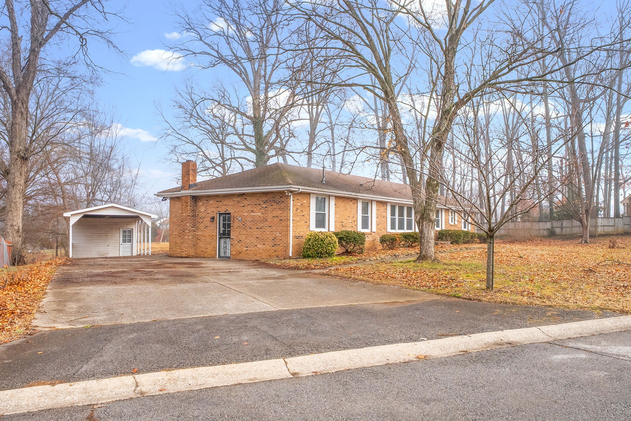 233 Pine Mountain Road Clarksville, TN 37042 - Photo 1 of 33 a front view of a house with a yard and garage
