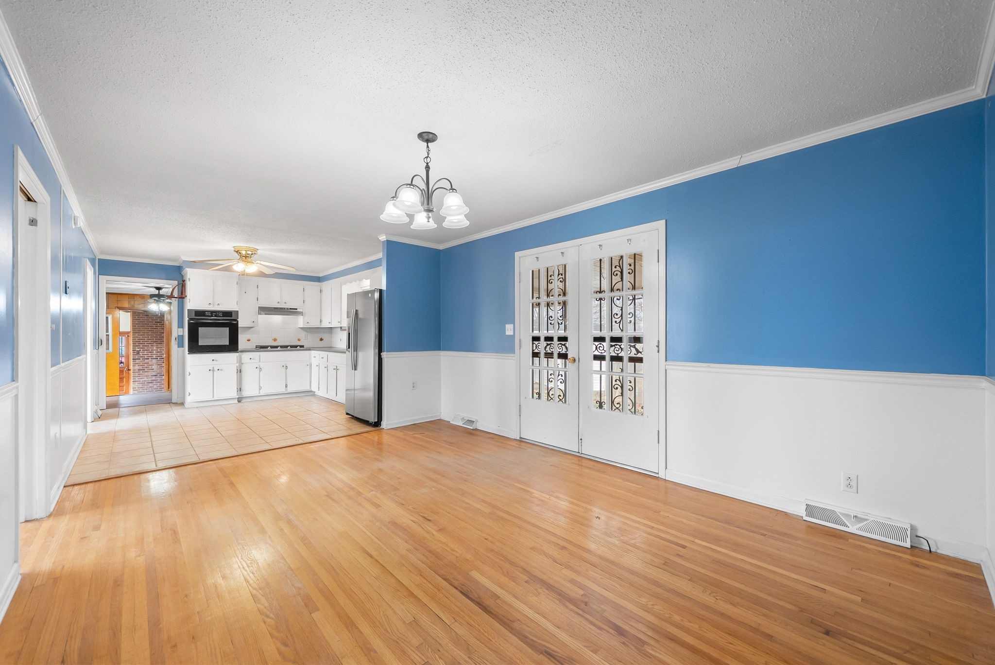 233 Pine Mountain Road Clarksville, TN 37042 - Photo 12 of 33 a view of a kitchen with wooden floor and kitchen space