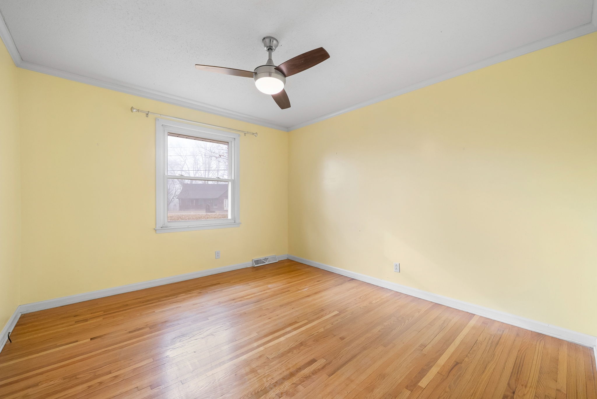 233 Pine Mountain Road Clarksville, TN 37042 - Photo 14 of 33 a view of empty room with wooden floor and fan