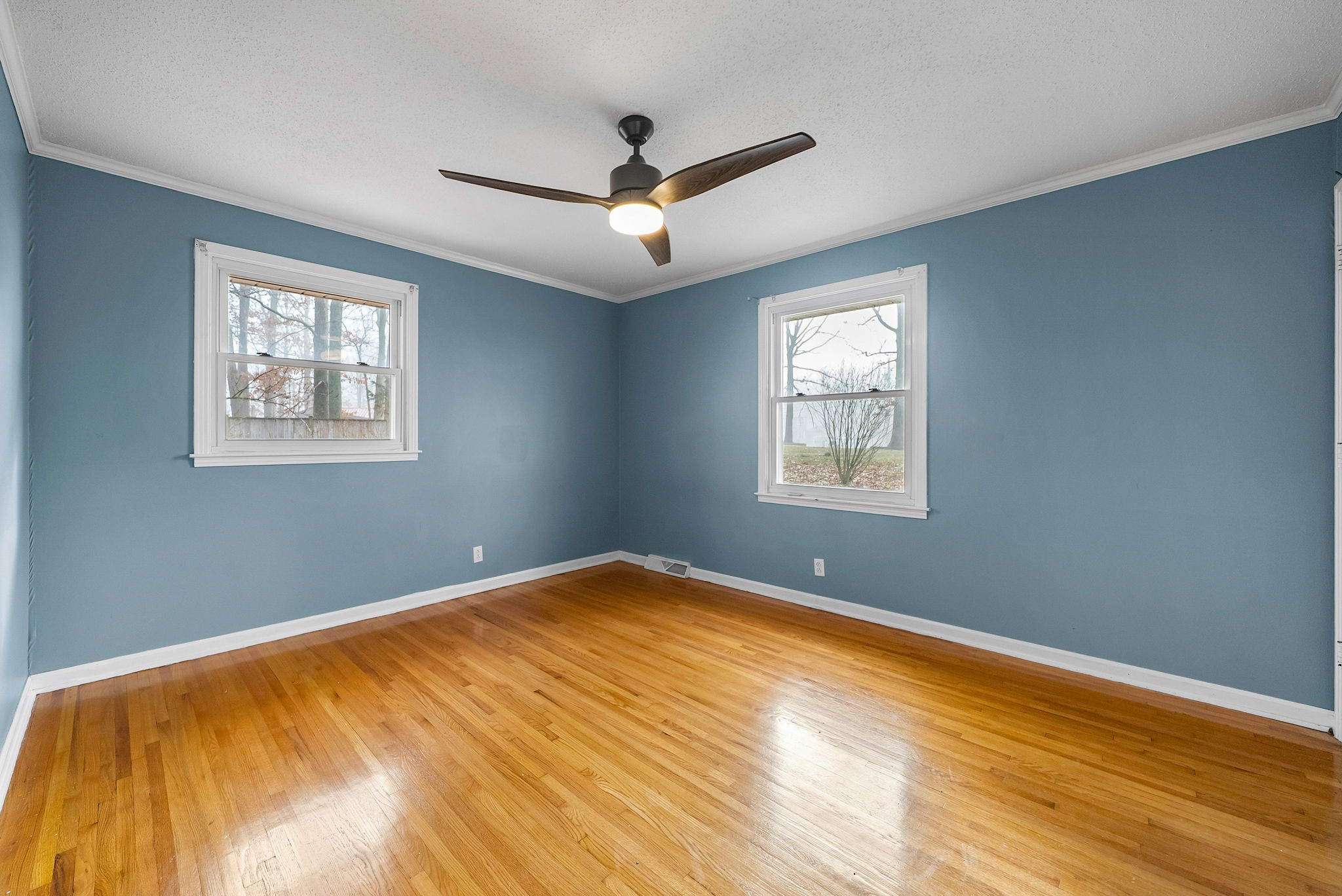 233 Pine Mountain Road Clarksville, TN 37042 - Photo 18 of 33 a view of an empty room with wooden floor and a window