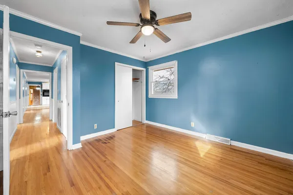 a view of a livingroom with a chandelier fan