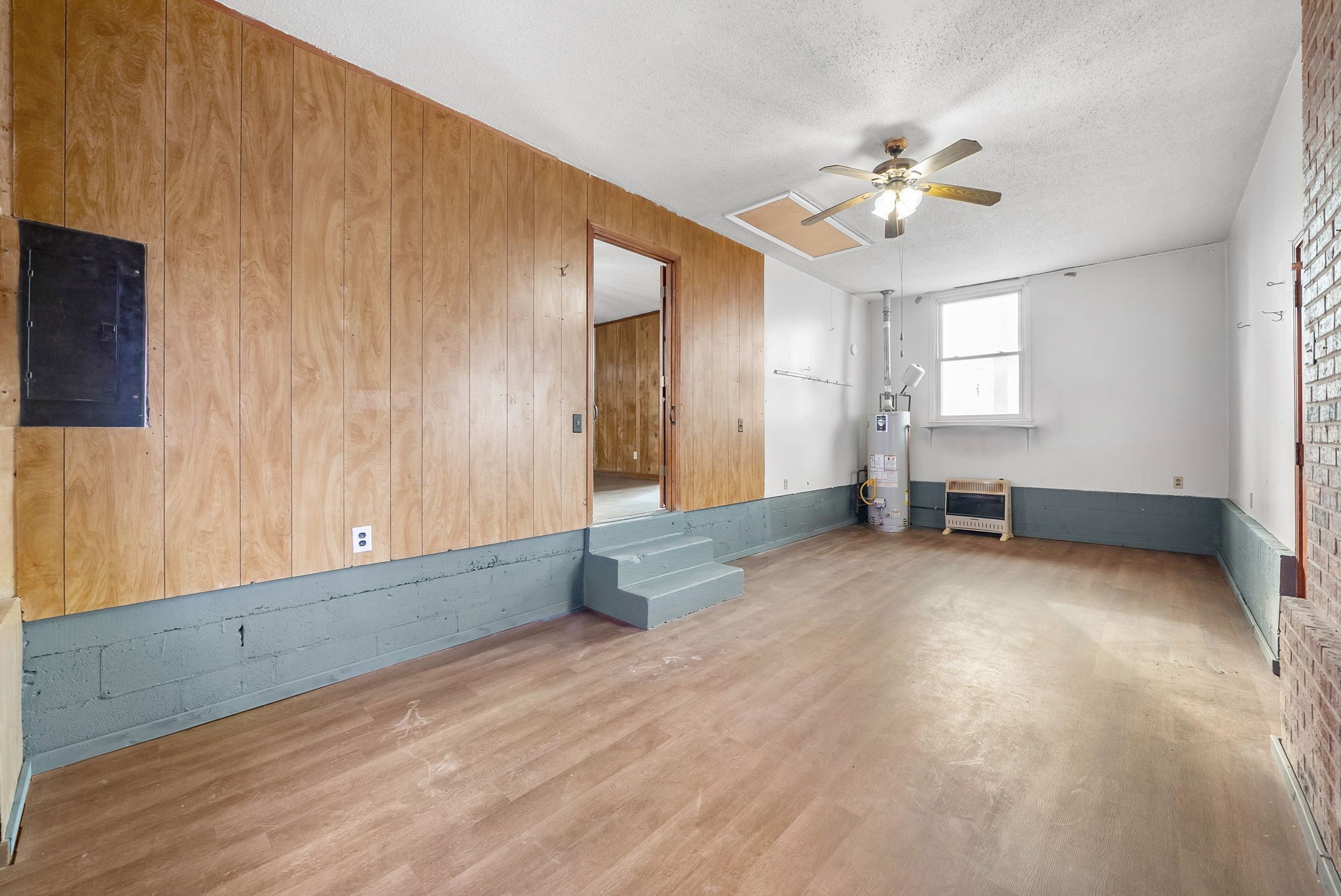 233 Pine Mountain Road Clarksville, TN 37042 - Photo 27 of 33 a view of an empty room with chandelier fan and windows