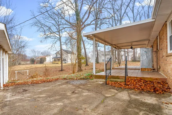 a view of a couches with wooden fence