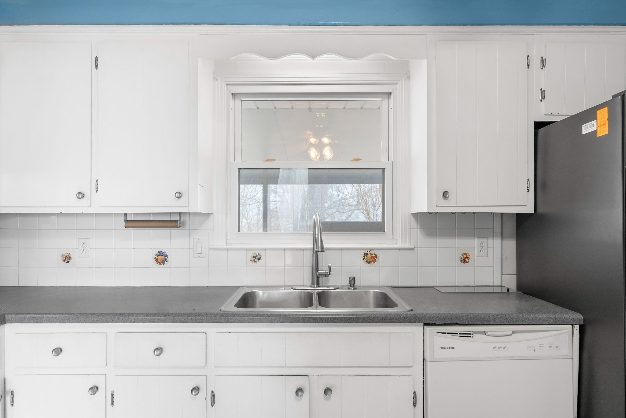 233 Pine Mountain Road Clarksville, TN 37042 - Photo 8 of 33 a kitchen with granite countertop white cabinets and a sink