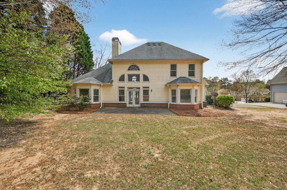7512 Fieldstone Way Monroe, GA 30656 - Photo 12 of 49 a front view of a house with a yard