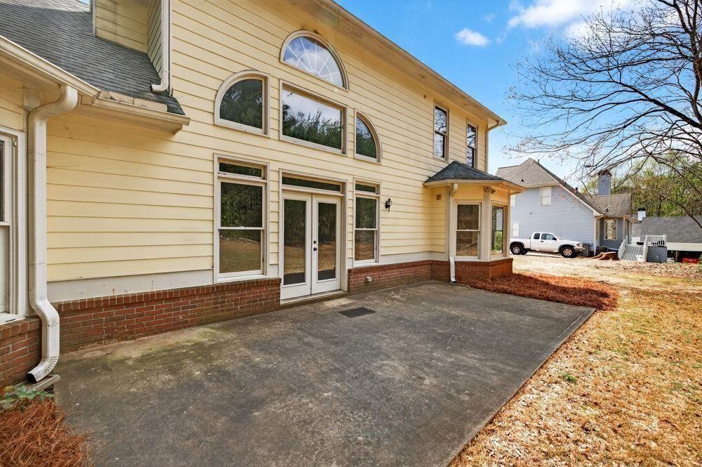 7512 Fieldstone Way Monroe, GA 30656 - Photo 13 of 49 a view of a white house with a large space