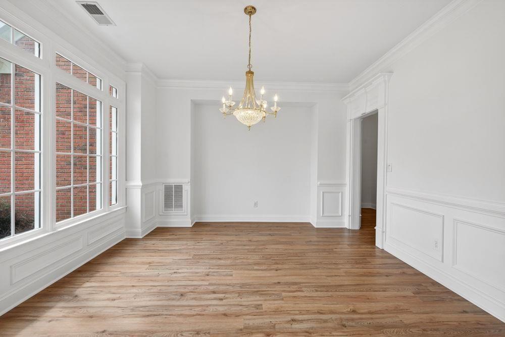 7512 Fieldstone Way Monroe, GA 30656 - Photo 2 of 49 a view of a livingroom with wooden floor and a large window